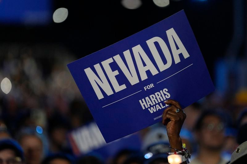 An attendee holds a sign for Democratic presidential nominee Vice President Kamala Harris during a rally on Sunday, Sept. 29, 2024, in Las Vegas. (AP Photo/Carolyn Kaster)