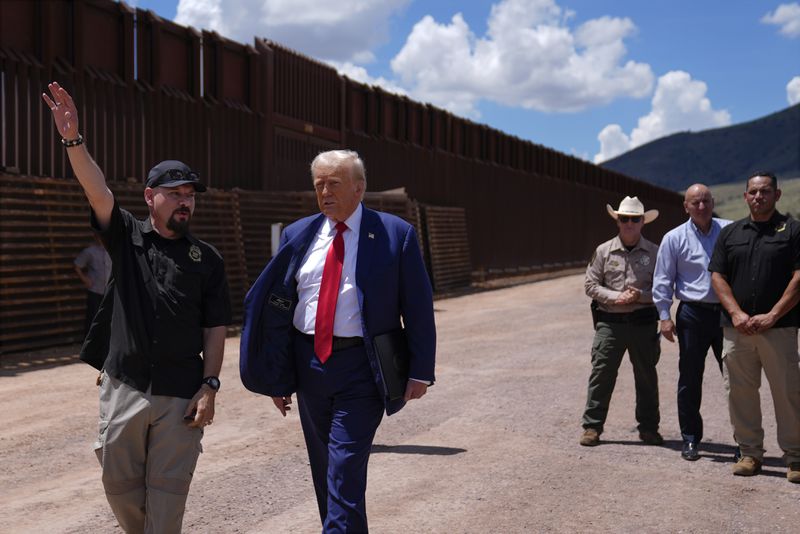 Republican presidential nominee former President Donald Trump listens to Paul Perez, president of the National Border Patrol Council, as he tours the southern border with Mexico, Thursday, Aug. 22, 2024, in Sierra Vista, Ariz. (AP Photo/Evan Vucci)