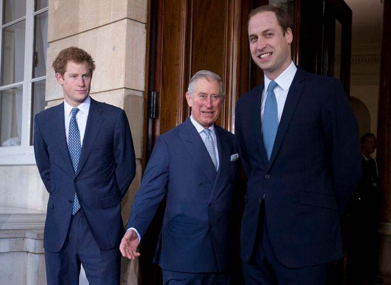 FILE - Britain's Prince Charles, center, with his sons Prince William, right, and Prince Harry stops for the media outside Lancaster House as they arrive to attend the Illegal Wildlife Trade Conference in London, on Feb. 13, 2014. (AP Photo/Alastair Grant, Pool, File)