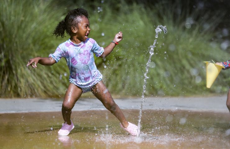 June 13, 2022 Atlanta:  Layla Hall-2 didn’t pay any attention to the heat index on Monday, June 13, 2022 as she frolicked in the water at the Historic Fourth Ward Park Splash Pad in Atlanta. Her mother, Ki Hall (not pictured) brings her usually three times a week. A combination of 90-degree heat and humidity pushed heat index values into the triple digits Monday and all across North Georgia. According to Channel 2 Action News meteorologist Eboni Deon, There could be showers and storms in the mix Tuesday, but Deon said even a 40% chance of rain won’t do much to tamp down the heat. “We’re going to do it all over again on Tuesday,” she said. “Heat index values anywhere from 105 in the Atlanta area, maybe approaching 110 in a few spots. Not the kind of heat you want to spend any time outdoors in.” Highs in the 90s are in the forecast every day this week and into the weekend, according to the latest forecast.  (John Spink / John.Spink@ajc.com)

