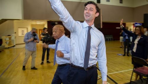 U.S. Senate candidate Jon Ossoff (foreground) and U.S. Rep. John Lewis wave to the crowd at the start of a voter registration rally at the MLK Recreation Center in Atlanta on Saturday, September 28, 2019. (Photo: STEVE SCHAEFER / SPECIAL TO THE AJC)
