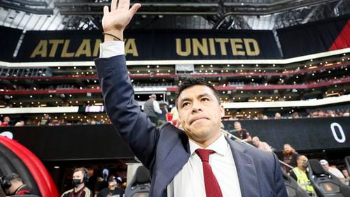 Atlanta United head coach Gonzalo Pineda waves to the fans after being introduced before the game against Orlando City at Mercedes-Benz Stadium on Sunday, July 17, 2022. Miguel Martinez /Miguel.martinezjimenez@ajc.com