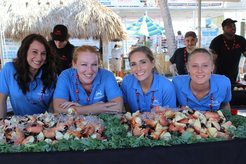 Servers from Pinchers serve stone crab claws non-stop during the annual Stone Crab Festival in Naples