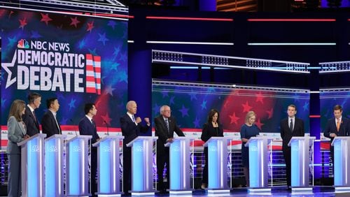 MIAMI, FLORIDA - JUNE 27: Democratic presidential candidates (L-R) Marianne Williamson, former Colorado governor John Hickenlooper, former tech executive Andrew Yang, South Bend, Indiana Mayor Pete Buttigieg, former Vice President Joe Biden, Sen. Bernie Sanders (I-VT), Sen. Kamala Harris (D-CA), Sen. Kirsten Gillibrand (D-NY), Sen. Michael Bennet (D-CO) and Rep. Eric Swalwell (D-CA) take part in the second night of the first Democratic presidential debate on June 27, 2019 in Miami, Florida.  A field of 20 Democratic presidential candidates was split into two groups of 10 for the first debate of the 2020 election, taking place over two nights at Knight Concert Hall of the Adrienne Arsht Center for the Performing Arts of Miami-Dade County, hosted by NBC News, MSNBC, and Telemundo. (Photo by Drew Angerer/Getty Images)