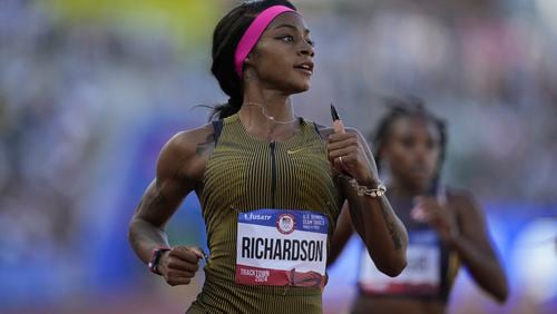 Sha'Carri Richardson wins a heat women's 100-meter run during the U.S. Track and Field Olympic Team Trials Friday, June 21, 2024, in Eugene, Ore. (AP Photo/Charlie Neibergall)