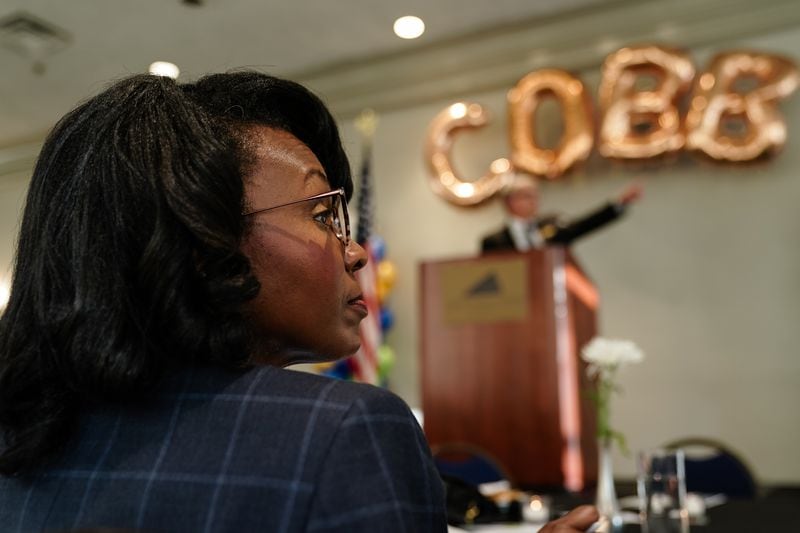 Lisa Cupid, Chairwoman of the Cobb County Board of Commissioners, watches a presentatipon by Mike Carnathan, Group Manager of Research & Analytics at the Atlanta Regional Commission, prior to delivering the Cobb County State of the County address at the Cobb Galleria Center on Thursday, May 16, 2024, in Atlanta. (Elijah Nouvelage for The Atlanta Journal-Constitution)