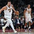 Denver Nuggets Nikola Jokic in action during a preseason game between Boston Celtics and Denver Nuggets in Abu Dhabi, United Arab Emirates, Friday, Oct. 4, 2024. (AP Photo/Martin Dokoupil)