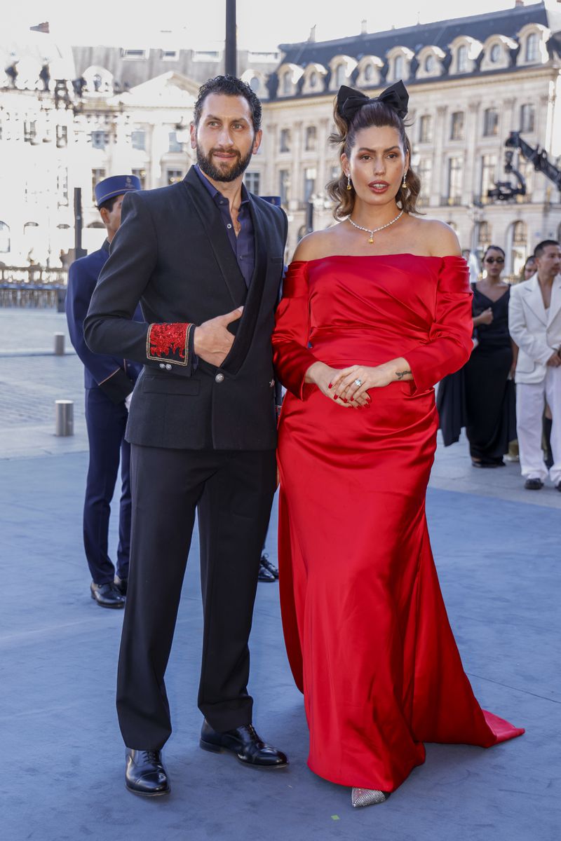 Karim Al-Fayed, left, and Brenda Costa pose for photographers upon arrival at the Vogue World event on Sunday, June 23, 2024 in Paris. (Photo by Vianney Le Caer/Invision/AP)