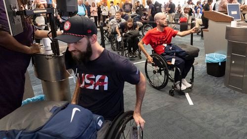 USA Paralympic wheelchair rugby team members board a Delta flight from Atlanta to Paris on Tuesday, Aug. 20, 2024. (Ben Gray / Ben@BenGray.com)