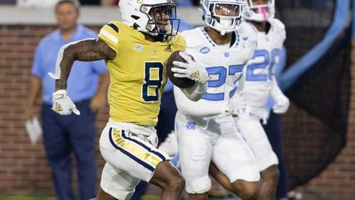 Georgia Tech Yellow Jackets wide receiver Malik Rutherford (8) runs 42 yards on a Haynes King pass to score a touchdown during the second quarter of an NCAA football game In Atlanta on Saturday, Oct. 28, 2023 between the Georgia Tech Yellow Jackets and the North Carolina Tar Heels.  (Bob Andres for the Atlanta Journal Constitution)