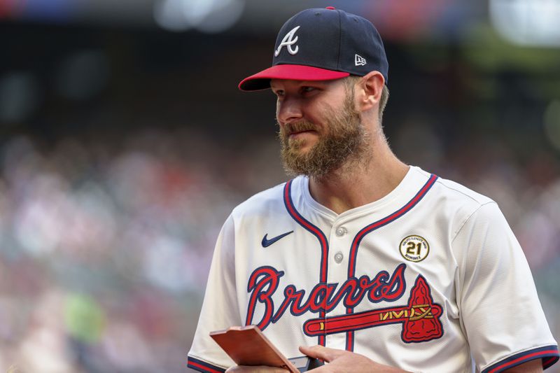 Atlanta Braves pitcher Chris Sale receives the Roberto Clemente Award before the start of a baseball game against the Los Angeles Dodgers, Sunday, Sept. 15, 2024, in Atlanta. (AP Photo/Jason Allen)