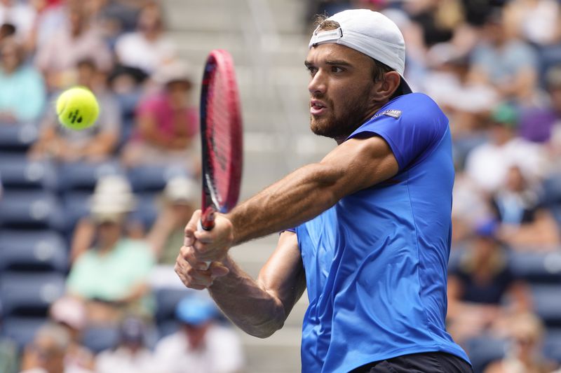 Tomas Machac, of the Czech Republic, returns a shot to Sebastian Korda, of the United States during the second round of the U.S. Open tennis championships, Thursday, Aug. 29, 2024, in New York. (AP Photo/Kirsty Wigglesworth)