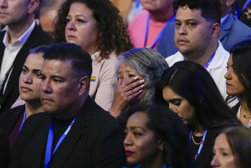 A woman reacts to Jon Polin and Rachel Goldberg, parents of hostage Hersh Goldberg-Polin speaking during the Democratic National Convention Wednesday, Aug. 21, 2024, in Chicago. (AP Photo/Matt Rourke)