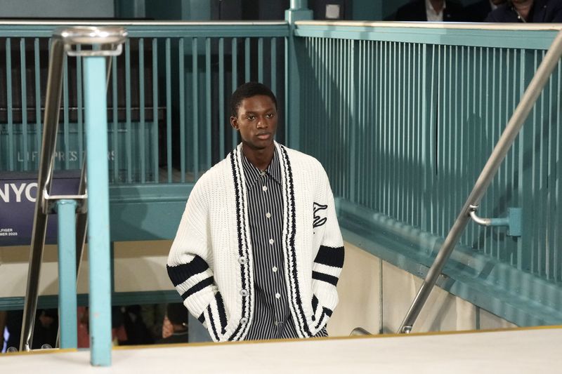 A model walks the runway during the Tommy Hilfiger Spring/Summer 2025 fashion show onboard a Staten Island Ferry as part of New York Fashion Week on Sunday, Sept. 8, 2024, in New York. (Photo by Charles Sykes/Invision/AP)