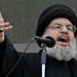 FILE - Hezbollah leader Sheik Hassan Nasrallah, speaks to the crowd in a rare public appearance during Ashura, that marks the death of Shiite Islam's Imam Hussein, in the suburbs of Beirut, Nov. 14, 2013. (AP Photo/Bilal Hussein, File)