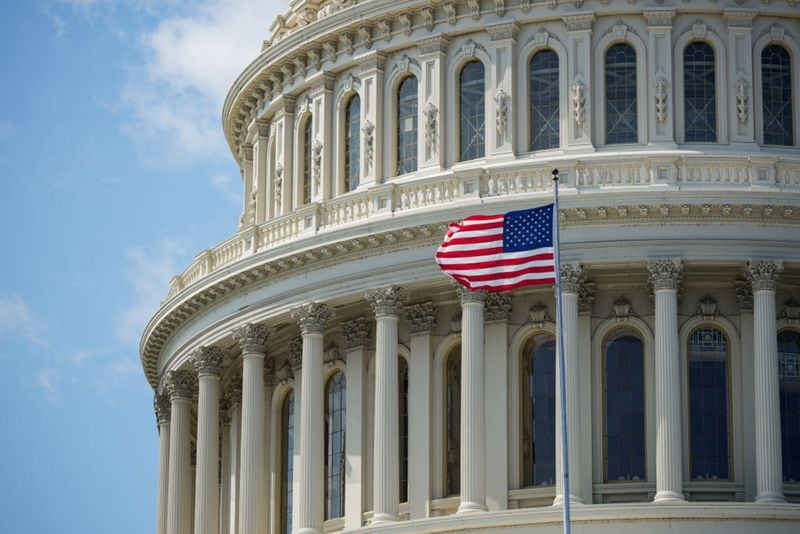 The American flag flies in front of the U.S. Capitol dome. Members of Congress return from summer break today. 