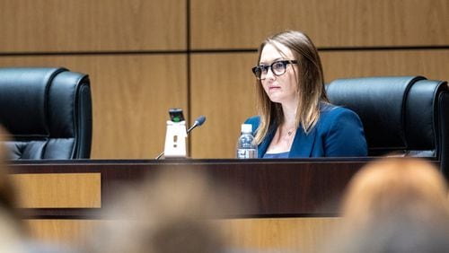 Katie Rinderle testifies at a hearing at the Cobb County Board of Education in Marietta on Thursday, August 10, 2023. Rinderle was fired in a split vote by the Cobb school board after reading “My Shadow is Purple,” a book that challenges gender norms, to fifth graders. (Arvin Temkar / arvin.temkar@ajc.com)