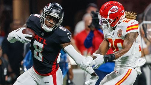 Atlanta Falcons tight end Kyle Pitts pushes away Kansas City Chiefs safety Justin Reid after a catch during the second half of an NFL football game against the Kansas City Chiefs on Sunday, Sept. 22, 2024, at Mercedes-Benz Stadium in Atlanta. 
(Miguel Martinez/ AJC)