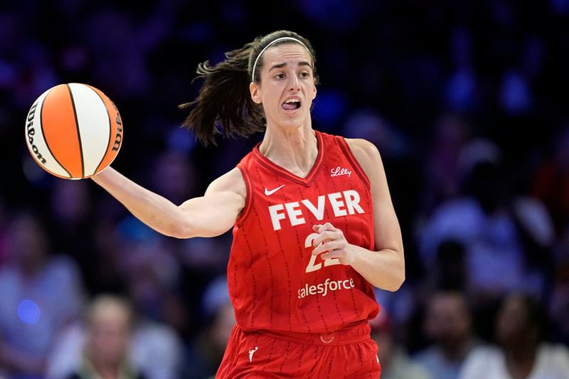 Indiana Fever's Caitlin Clark makes a long pass upcourt in the first half of a WNBA basketball game against the Dallas Wings, Sunday, Sept. 1, 2024, in Arlington, Texas. (AP Photo/Tony Gutierrez)