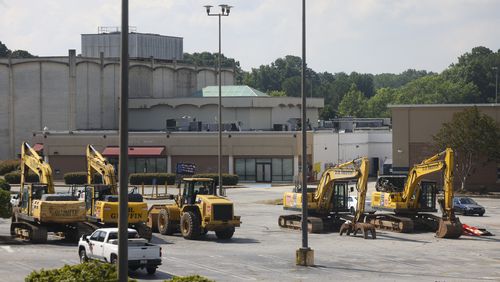 Construction equipment is shown in a parking lot at the North DeKalb Mall, Monday, June 24, 2024, in Decatur, Ga. The North DeKalb mall is scheduled to be demolished starting Wednesday morning, June 26th. (Jason Getz / AJC)
