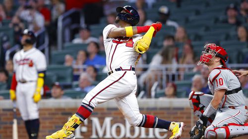 Atlanta Braves Ronald Acuna Jr. hits a sacrifice fly in the sixth inning of a baseball game against the Philadelphia Phillies, Tuesday, May 24, 2022, in Atlanta. (AP Photo/Todd Kirkland)