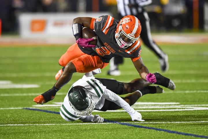 Collins HIll’s CJ Hector (1) makes a tackle on North Cobb’s David Eziomume (2) during the first half of play Friday, Nov. 10, 2023 at North Cobb High School. (Daniel Varnado/For the AJC)