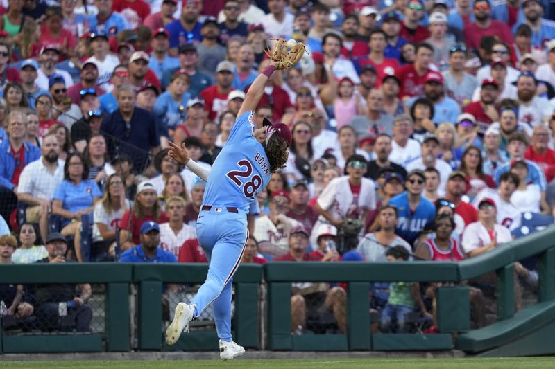Philadelphia Phillies third baseman Alec Bohm catches a fly out by Los Angeles Dodgers' Miguel Rojas during the sixth inning of a baseball game, Thursday, July 11, 2024, in Philadelphia. (AP Photo/Matt Slocum)