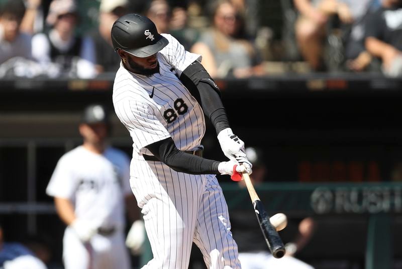 Chicago White Sox's Luis Robert Jr. hits a home run during the first inning of a baseball game against the Atlanta Braves Thursday, June 27, 2024, in Chicago. (AP Photo/Melissa Tamez)