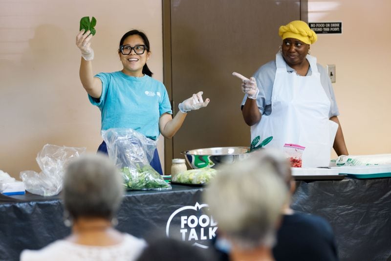 Cecilia Tran, a Family & Consumer Sciences Agent with UGA, shows a piece of spinach during a nutrition demonstration class at St Mark AME Church on Tuesday, June 18, 2024, in Atlanta.
(Miguel Martinez / AJC)