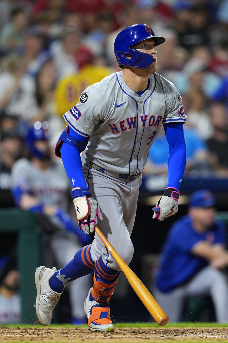 New York Mets' Brandon Nimmo watches his three run home run off Philadelphia Phillies' Aaron Nola during the fifth inning of a baseball game, Friday, Sept. 13, 2024, in Philadelphia. (AP Photo/Derik Hamilton)