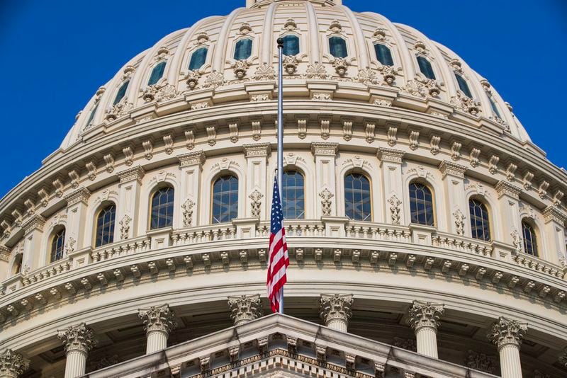 The American flag flies at half-staff at the Capitol in honor of Sen. John McCain of Arizona who died Saturday of brain cancer, in Washington, Monday, Aug. 27, 2018. McCain will lie in state in the Capitol Rotunda on Friday. (AP Photo/J. Scott Applewhite)