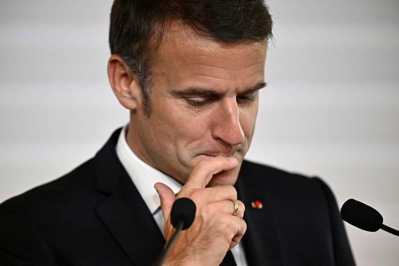 File - French President Emmanuel Macron reacts as he delivers his speech during the opening session of the the African Vaccine Manufacturing Accelerator conference, Thursday, June 20, 2024 in Paris. Emmanuel Macron once appeared as a bold, young leader offering to revive France through radical pro-business, pro-European policies so that voters have "no reason anymore" to vote for the extremes. Seven years after he was first elected, his call for snap elections weakens him at home and abroad, while it appears to propel the far right on the verge of power. (Dylan Martinez/Pool via AP, File)