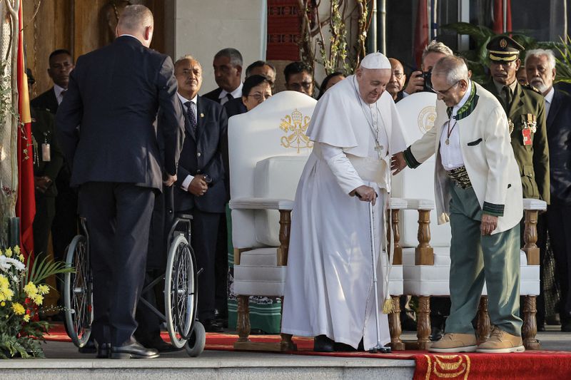 Pope Francis and East Timor's President Jose Ramos-Horta, right, arrive for a welcoming ceremony at the Presidential Palace in Dili, East Timor, Monday Sept. 9, 2024. (Yasuyoshi Chiba/Pool Photo via AP)