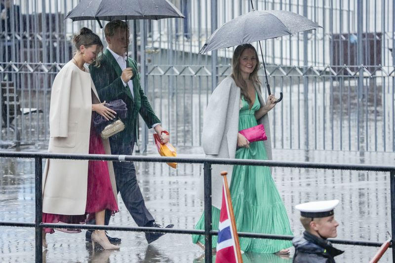 Norway's Princess Ingrid Alexandra, Prince Sverre Magnus and Amalie Giæver MacLeod walk on their way to a theme party at Hotel Union in Geiranger, Norway, on Friday, Aug. 30, 2024, the evening before the wedding ceremony of Princess Märtha Louise and Derek Verrett. (Cornelius Poppe/NTB Scanpix via AP)