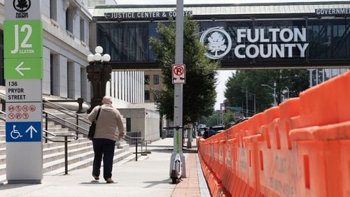 Orange barricades are seen in front of Fulton County Courthouse in Atlanta on Thursday, July 27, 2023. (Arvin Temkar / arvin.temkar@ajc.com)