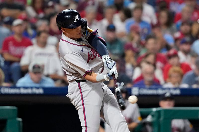 Atlanta Braves' Gio Urshela hits a run-scoring double against Philadelphia Phillies pitcher Max Lazar during the sixth inning of a baseball game, Friday, Aug. 30, 2024, in Philadelphia. (AP Photo/Matt Slocum)