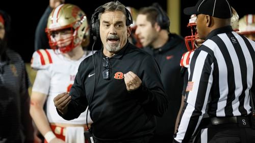 Rome head coach John Reid talks with an official during their game against Langston Hughes in the Class 6A semi-final at Lakewood Stadium, Friday, December 2, 2022, in Atlanta. Jason Getz / Jason.Getz@ajc.com)
