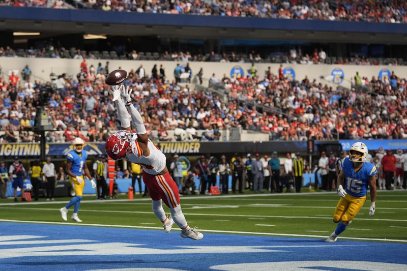 Kansas City Chiefs defensive back Jaden Hicks is unable to make an interception in the end zone during the second half of an NFL football game against the Los Angeles Chargers Sunday, Sept. 29, 2024, in Inglewood, Calif. (AP Photo/Marcio Jose Sanchez)