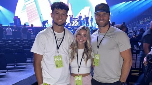 Jake Camarda (left), a punter for Tampa Bay Buccaneers, his wife Kinsley, and Josh Moran, a UGA law student who was Camarda’s teammate when he played for the Georgia Bulldogs, have teamed up with a campus ministry group to organize something they’re calling “Unite Georgia.”