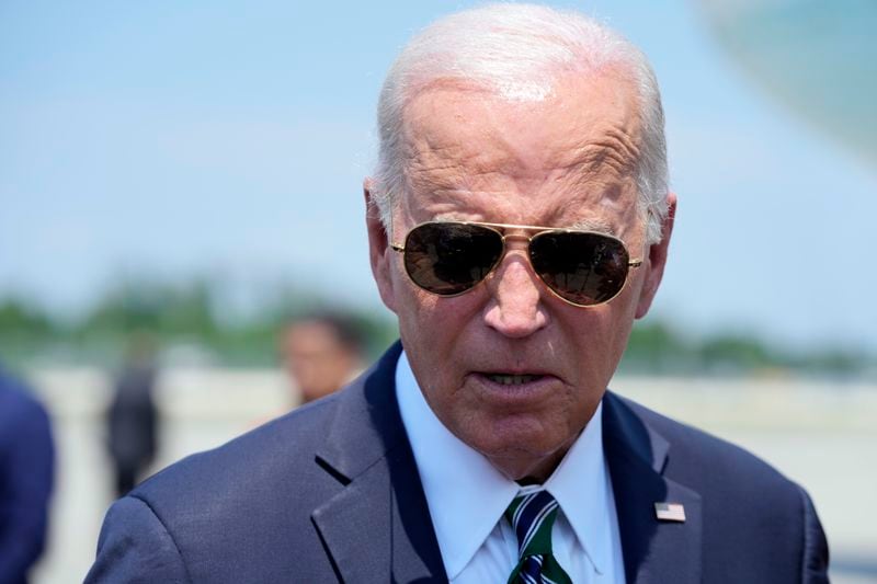 President Joe Biden talks with reporters Tuesday, Aug. 13, 2024, at Louis Armstrong International Airport in New Orleans. (AP Photo/Mark Schiefelbein)