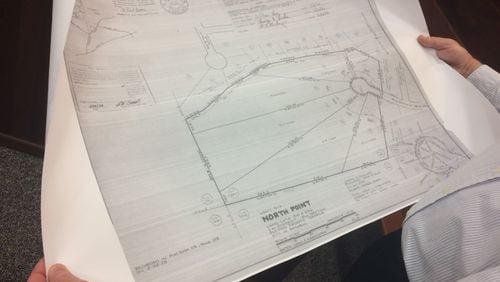 Mike Hartley, North Point resident, pointed to property plans from 1979 at a Roswell Planning Commission meeting in February. He opposes a proposed development in the neighborhood.