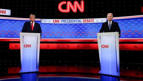 President Joe Biden, right, and Republican presidential candidate former President Donald Trump, left, stand during a break in a presidential debate hosted by CNN, Thursday, June 27, 2024, in Atlanta. (AP Photo/John Bazemore)