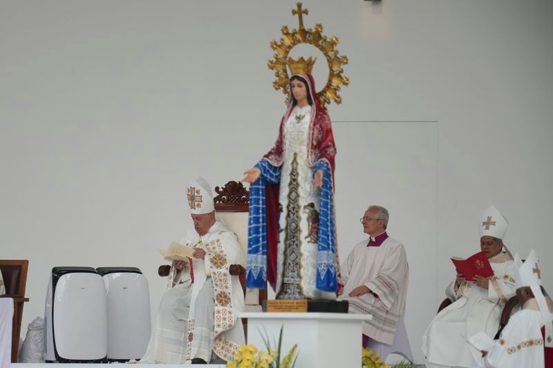 Pope Francis, left, leads the holy mass at Gelora Bung Karno Stadium in Jakarta, Indonesia, Thursday, Sept. 5, 2024. (AP Photo/Achmad Ibrahim, Pool)