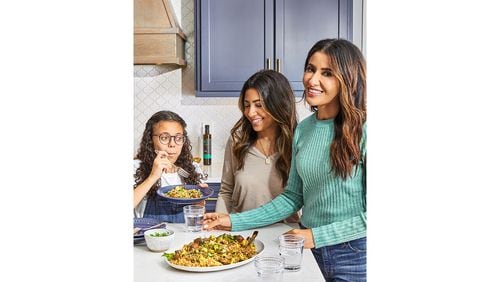 Suzy Karadsheh, author of "The Mediterranean Dish," with daughter (left to right) Hannah and Dara. / 
Courtesy of Caitlin Bensel