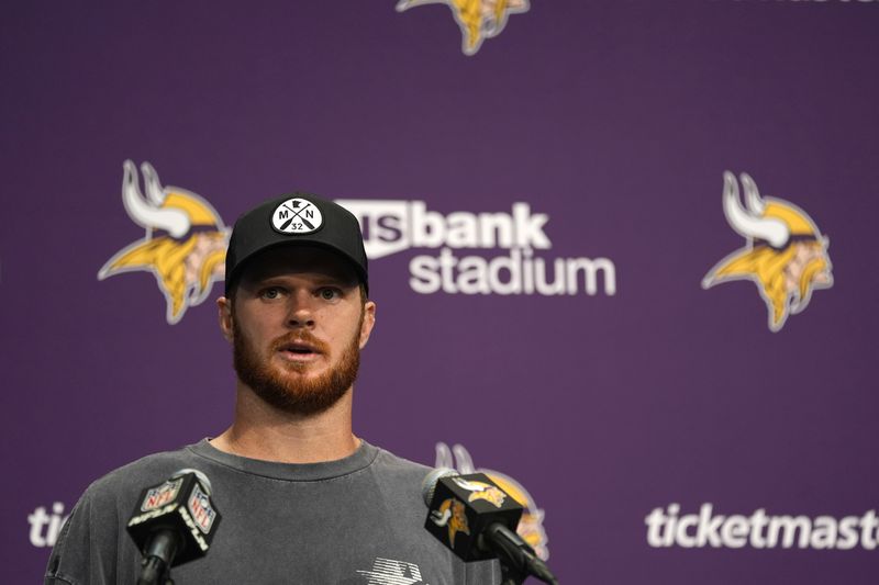 Minnesota Vikings quarterback Sam Darnold speaks during a news conference after an NFL football game against the San Francisco 49ers, Sunday, Sept. 15, 2024, in Minneapolis. The Vikings won 23-17. (AP Photo/Abbie Parr)