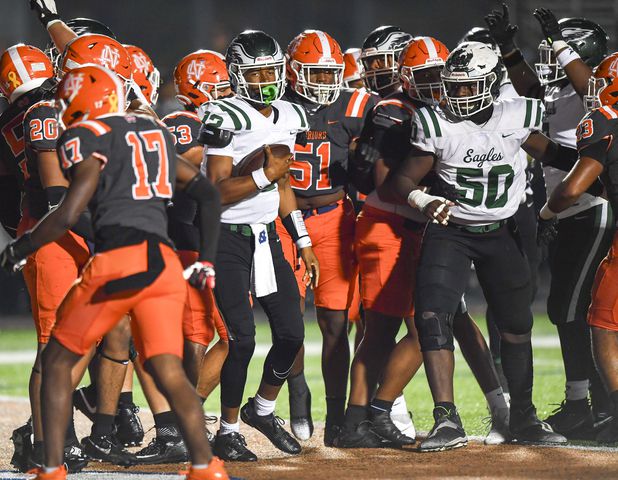 Collins Hill quarterback RJ Wilcox (12) carries the ball into North Cobbs end zone for a touchdown during the first half of play Friday, Nov. 10, 2023 at North Cobb High School. (Daniel Varnado/For the AJC)