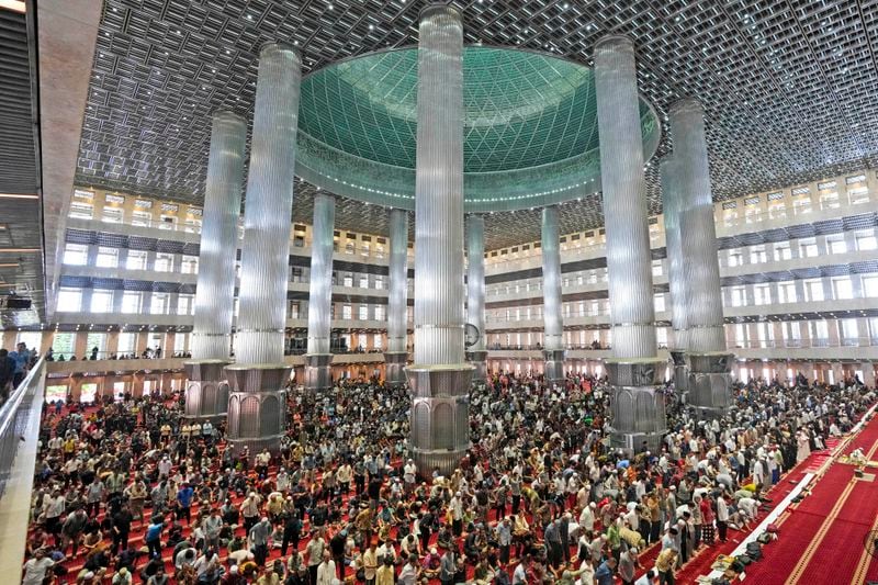 Muslim men attend Friday prayer at Istiqlal Mosque in Jakarta, Indonesia, Friday, Aug. 9, 2024, where Pope Francis is scheduled to hold an interfaith meeting on Sept. 5. (AP Photo/Tatan Syuflana)