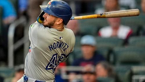 Toronto Blue Jays' Spencer Horwitz (48) hits a solo homer in the first inning of a baseball game against the Atlanta Braves, Saturday, Sept. 7, 2024, in Atlanta.(AP Photo/Mike Stewart)