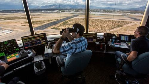 FILE - Air traffic controllers watch for traffic from the control tower at the Tucson International Airport, Friday, Sept. 23, 2016, in Tucson, Ariz. The Federal Aviation Administration said Wednesday, July 24, 2024, that it reached an agreement the union that allow air traffic controllers to get more rest between shifts. (Ron Medvescek/Arizona Daily Star via AP, File)