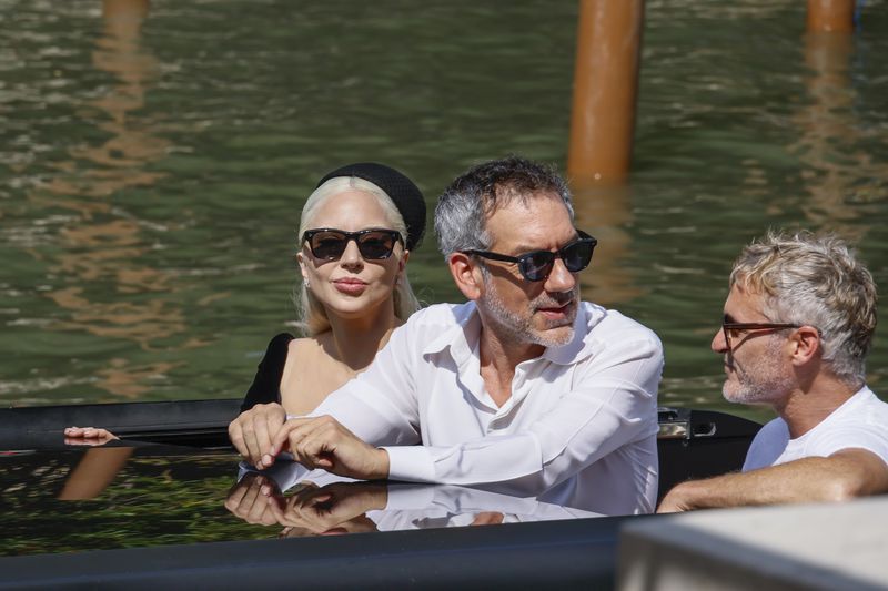 Lady Gaga, from left, director Todd Phillips, and Joaquin Phoenix upon arrival for the press conference of the film 'Joker: Folie A Deux' during the 81st edition of the Venice Film Festival in Venice, Italy, on Wednesday, Sept. 4, 2024. (Photo by Joel C Ryan/Invision/AP)